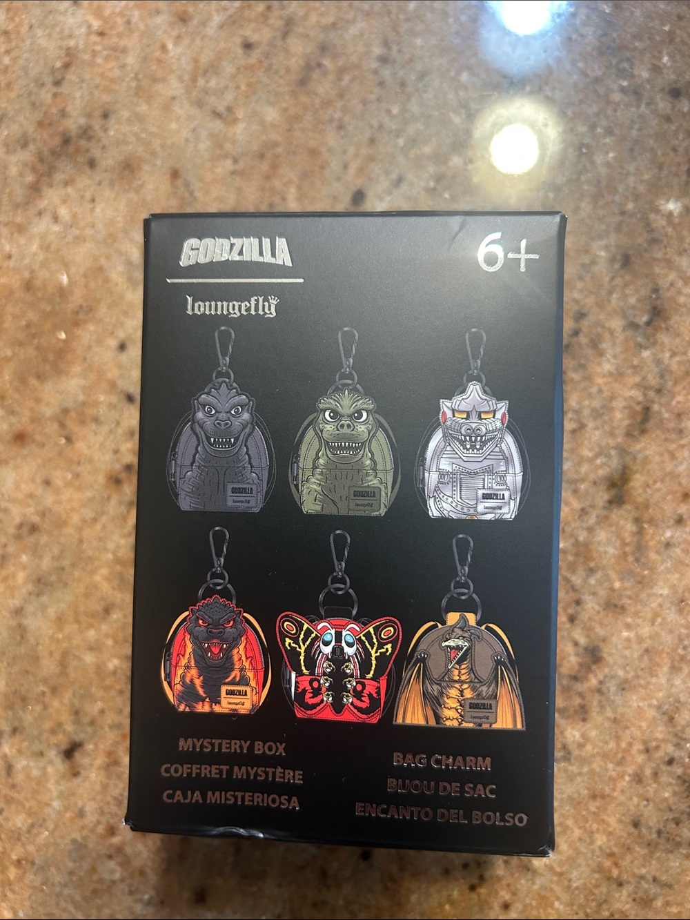 Loungefly Godzilla Bag Charm Mystery Box - Black with Red, Yellow, Green Accents